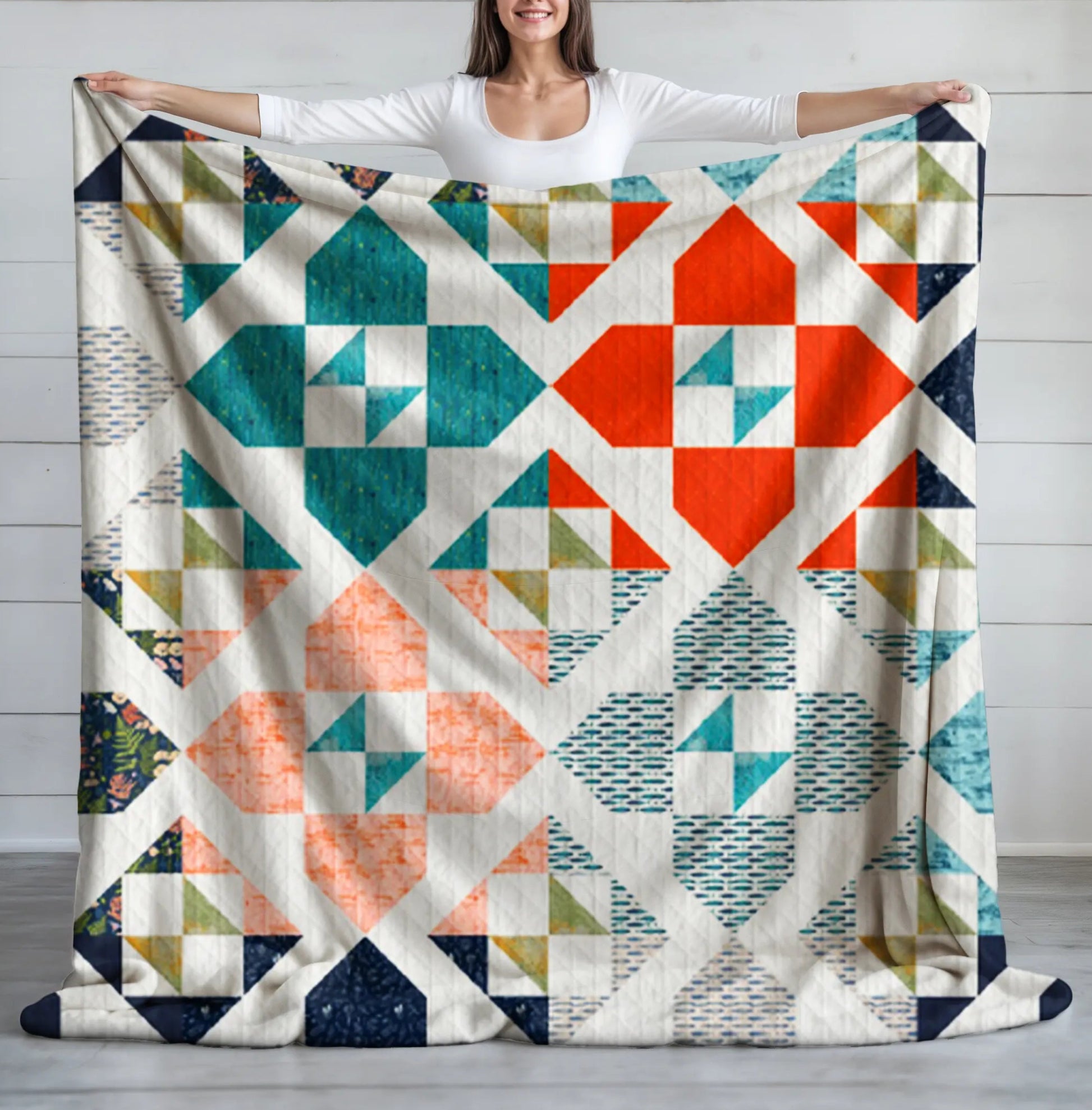 A vibrant geometric quilt featuring bold red, blue, green, and orange diamond and triangle patterns, ideal for a modern or farmhouse look.