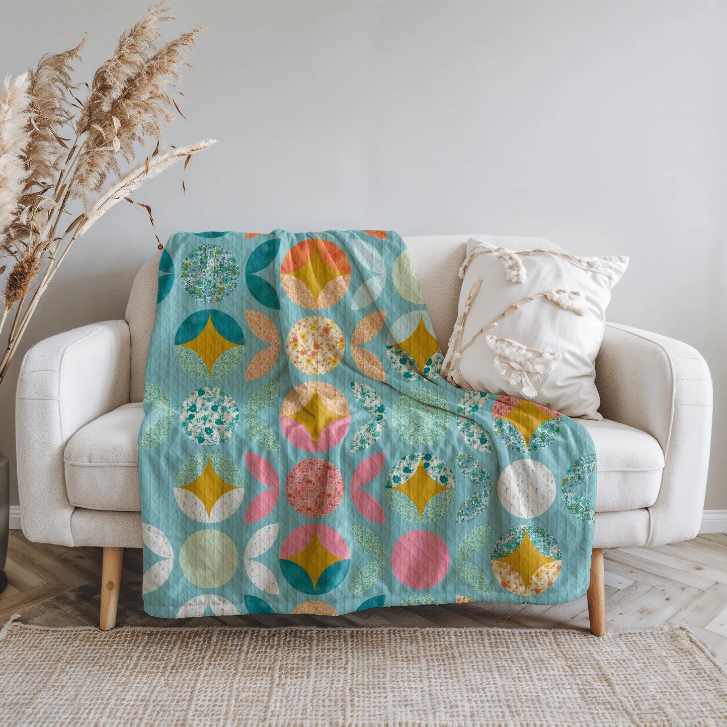 Boho-style quilt with a modern circular patchwork design, ideal for a fresh and contemporary home decor.