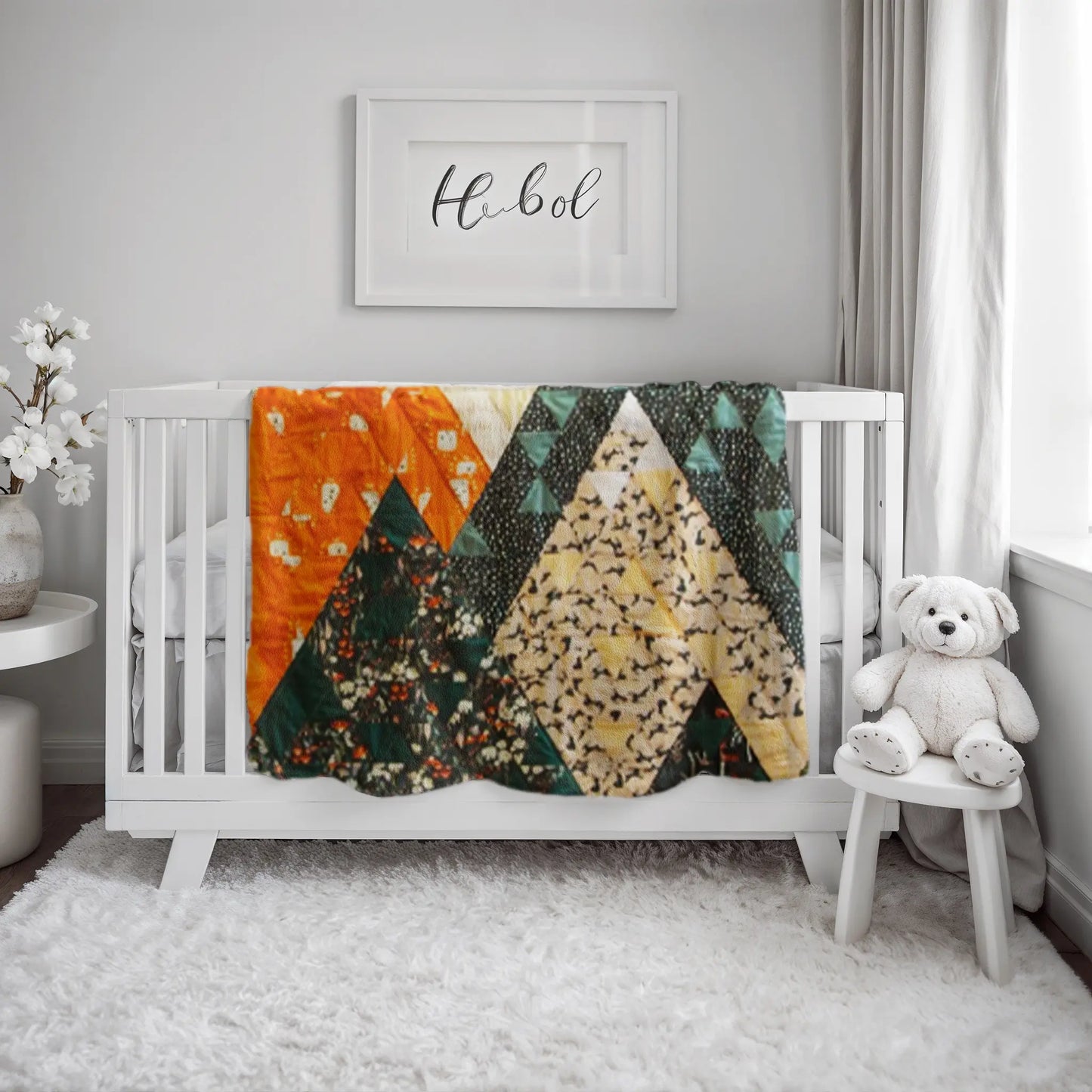 Handmade quilt with an abstract mountain peak design, blending nature-inspired patterns with contemporary quilting techniques.